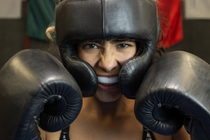 a female boxer wearing a mouthguard